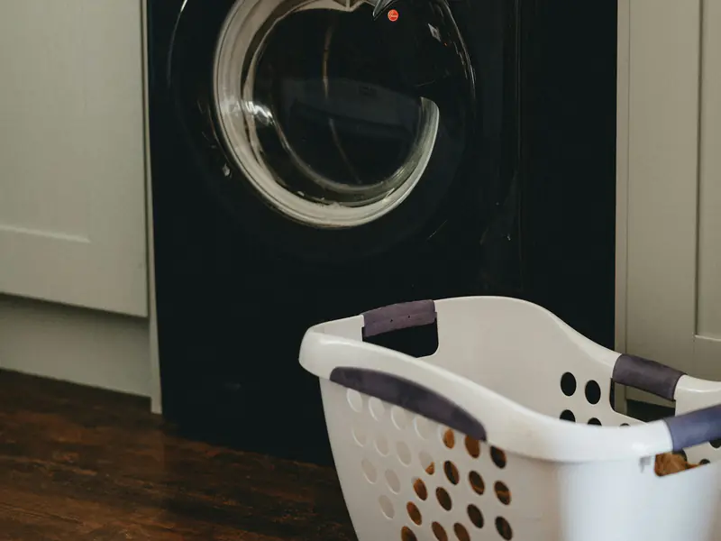 Front-loading washing machine installed under a kitchen counter